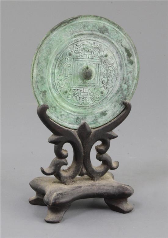 A Chinese bronze circular TLV mirror, Han dynasty or later, 11cm diameter